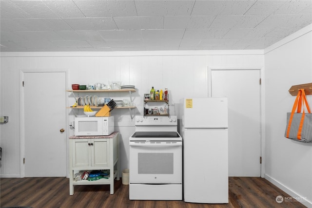 kitchen with dark hardwood / wood-style flooring and white appliances