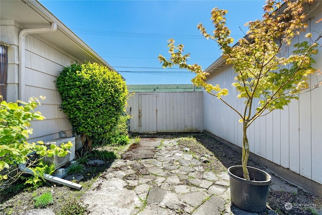 view of patio featuring a shed