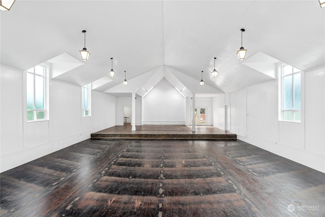 interior space with dark wood-type flooring and lofted ceiling