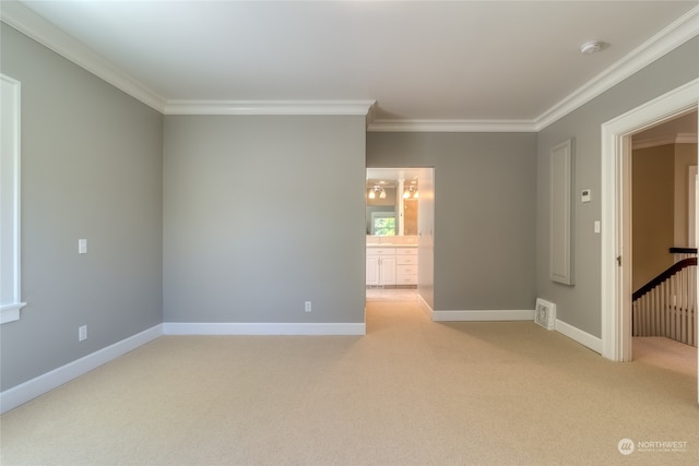 carpeted empty room with ornamental molding