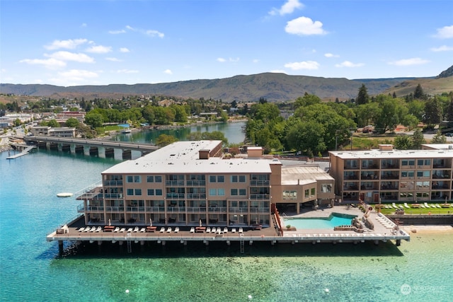 exterior space featuring a water and mountain view