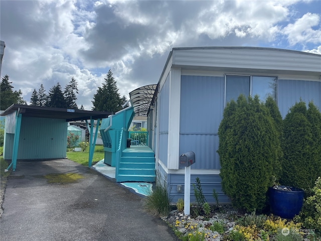 view of home's exterior with a carport