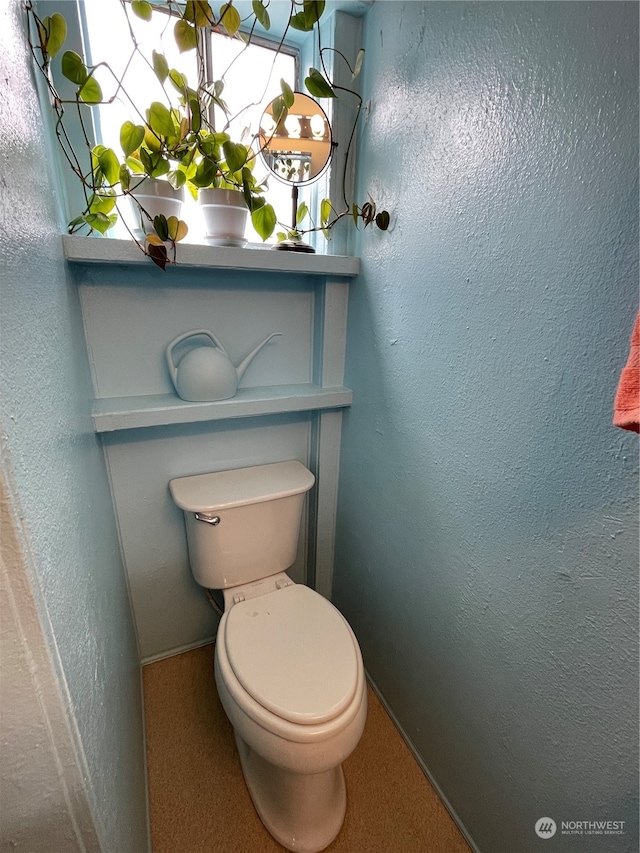 bathroom featuring toilet