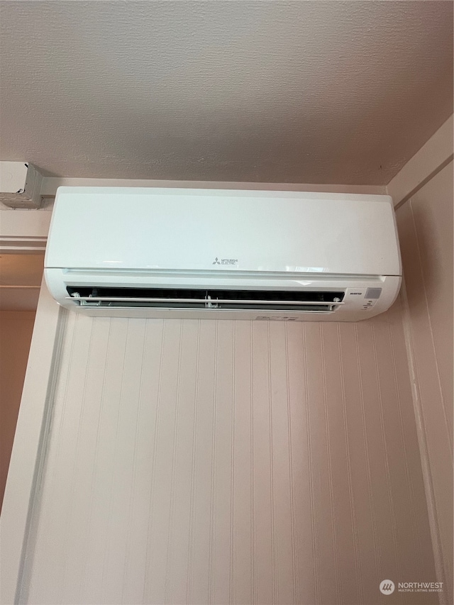 interior details featuring a wall mounted air conditioner