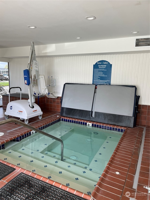 view of pool with an indoor in ground hot tub