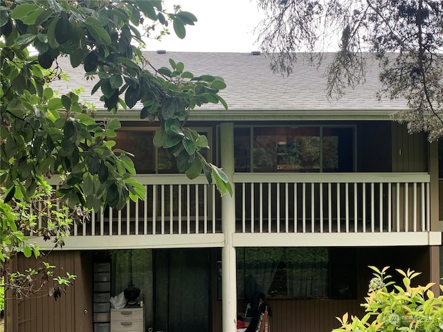 back of house featuring a balcony