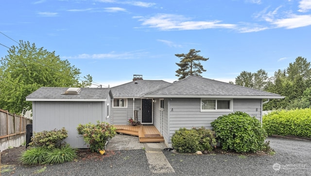 ranch-style home featuring a wooden deck