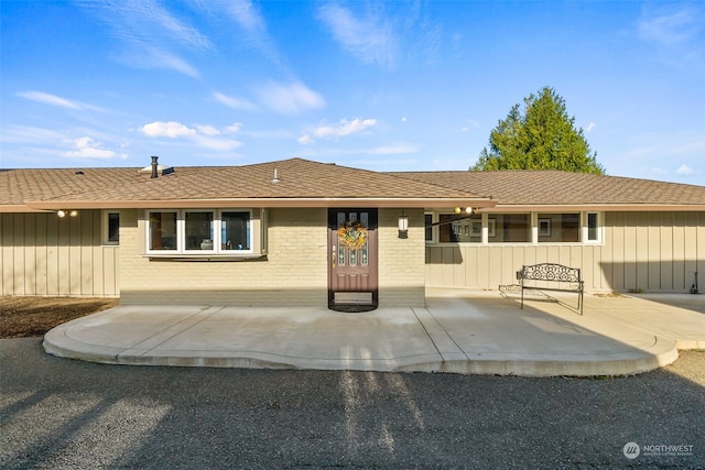 ranch-style home featuring a patio area