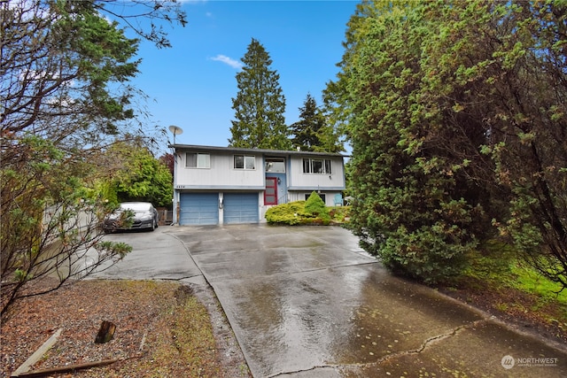 raised ranch featuring a garage