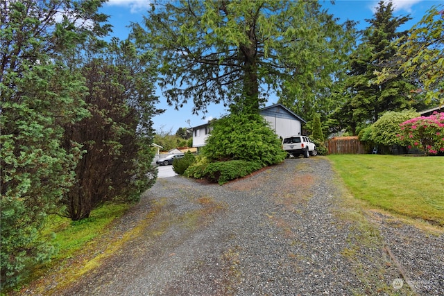 view of property exterior with a yard