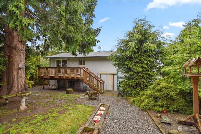 back of house featuring a deck