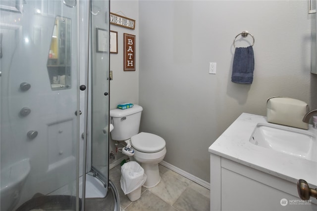 bathroom with vanity, toilet, and walk in shower