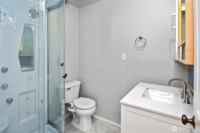 bathroom featuring a shower stall, baseboards, vanity, and toilet