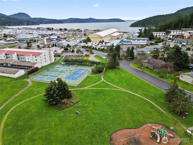 drone / aerial view with a water and mountain view