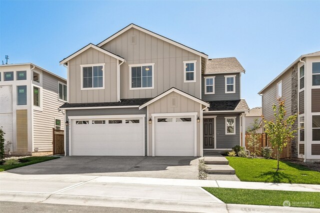 view of front facade featuring a garage and a front lawn