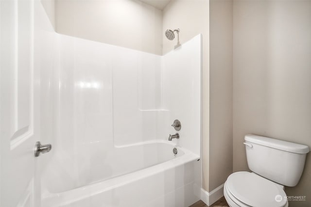 full bathroom with toilet and bathing tub / shower combination