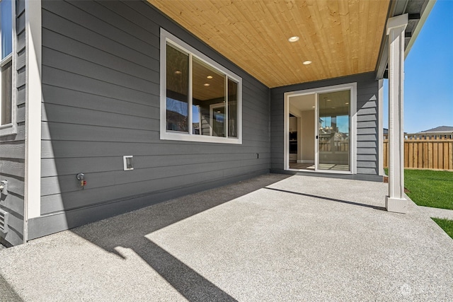 view of patio featuring fence