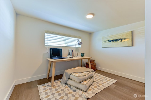 office with wood finished floors and baseboards