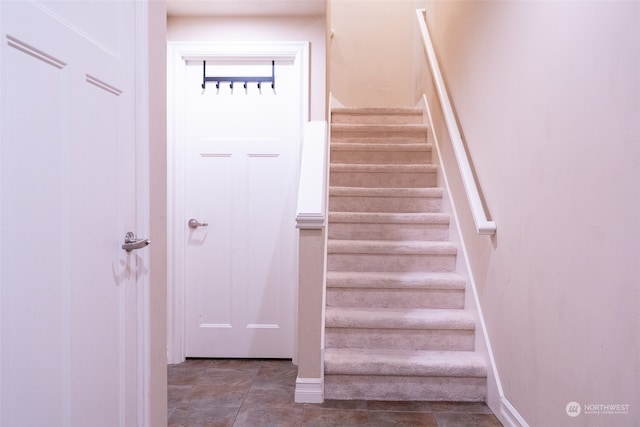 stairs featuring tile floors