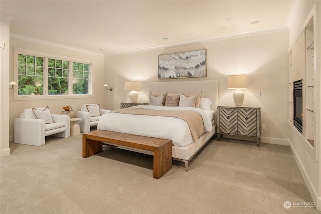 carpeted bedroom with ornamental molding