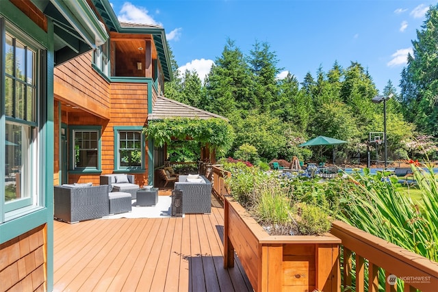 wooden deck with an outdoor living space