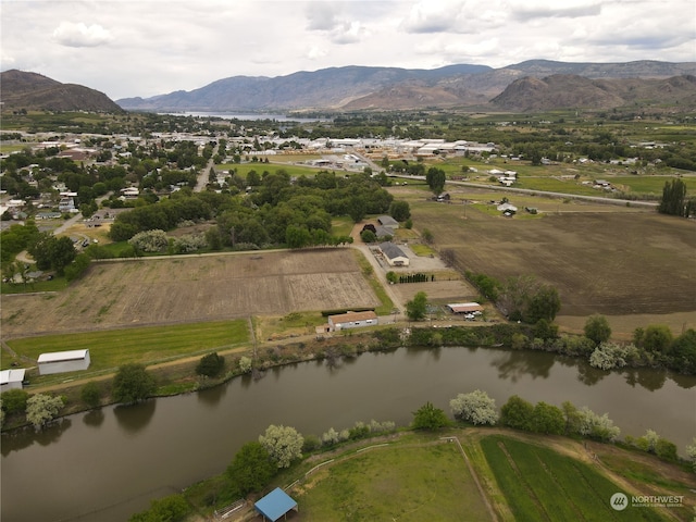 birds eye view of property featuring a water and mountain view