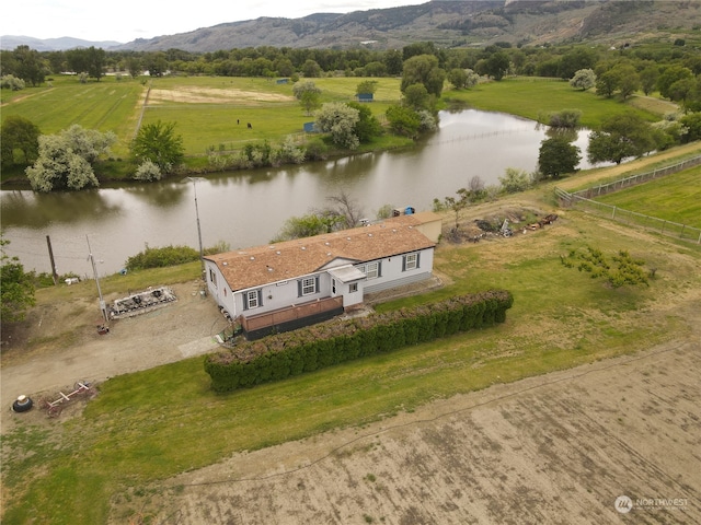 drone / aerial view featuring a water view and a rural view