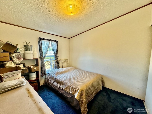12 Moonlight Dr, Oroville, WA 98844 - bedroom with ornamental molding, carpet, and a textured ceiling