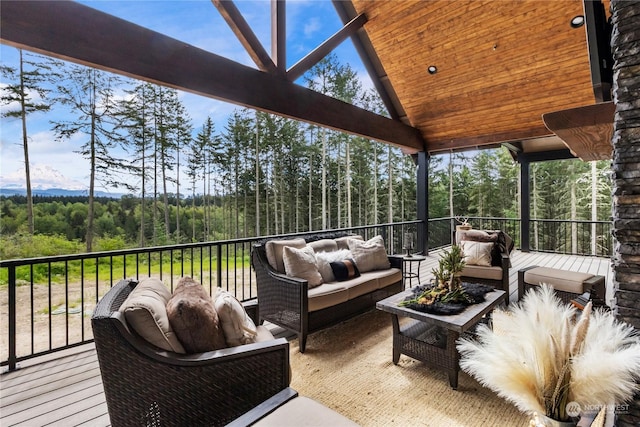 sunroom / solarium featuring vaulted ceiling