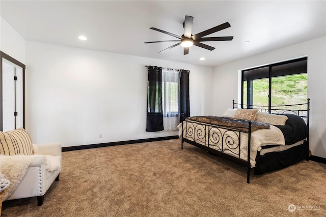 carpeted bedroom with ceiling fan