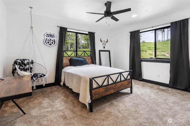 carpeted bedroom with ceiling fan