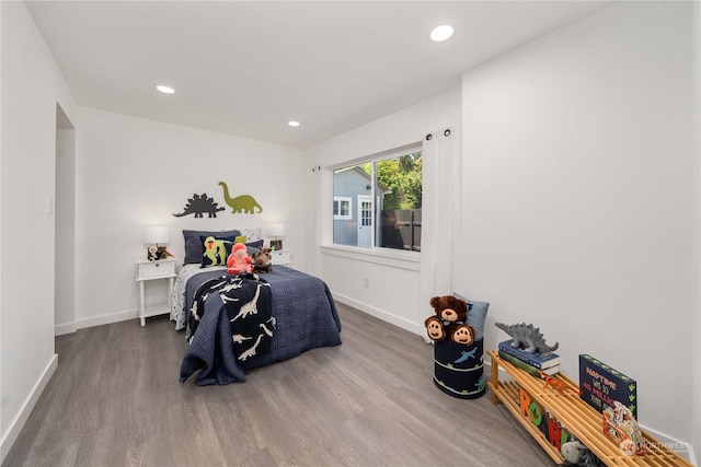 bedroom with hardwood / wood-style floors