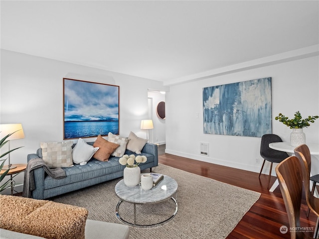 living room with dark hardwood / wood-style flooring