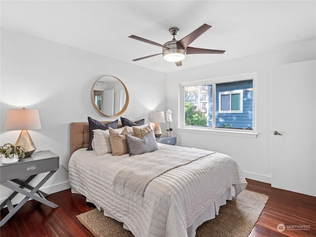 bedroom featuring ceiling fan and dark hardwood / wood-style flooring