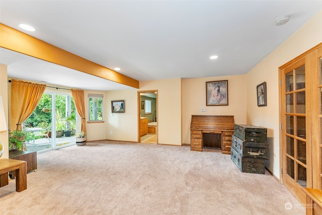 unfurnished living room featuring recessed lighting, baseboards, and carpet floors