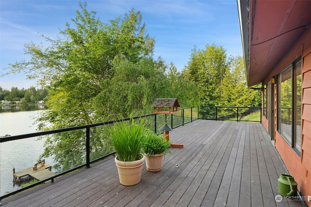 wooden deck featuring a water view