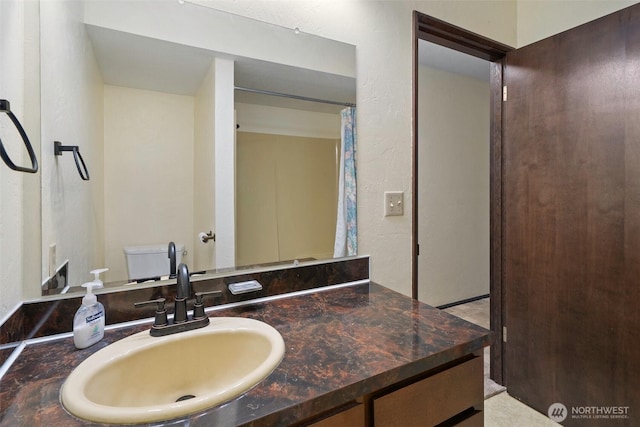 full bath with toilet and vanity