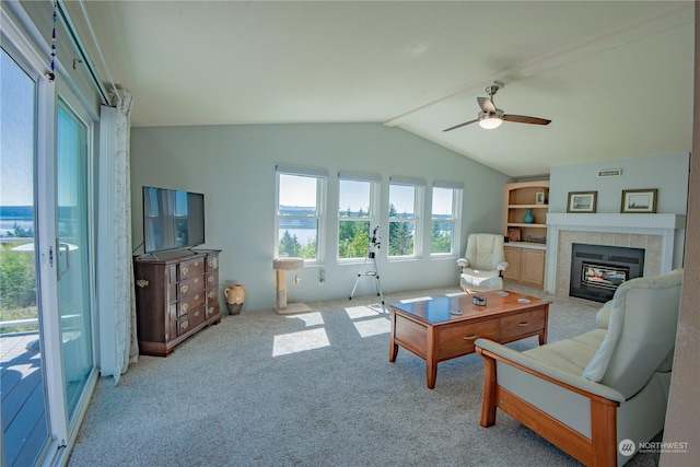 living room with light colored carpet, ceiling fan, and lofted ceiling