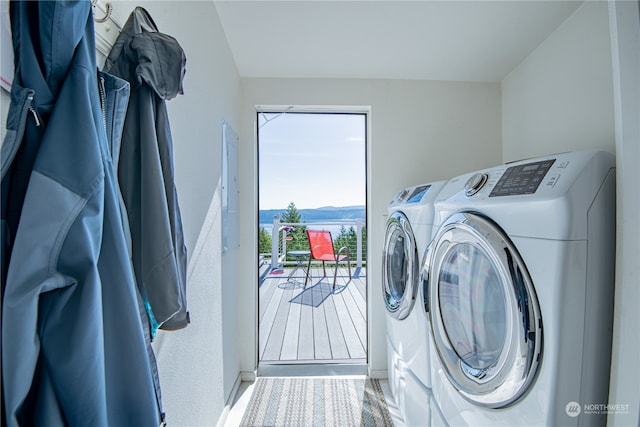 laundry area featuring hardwood / wood-style floors and washing machine and dryer