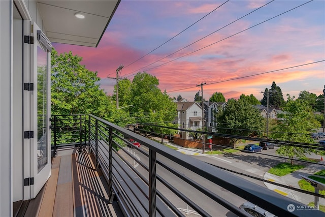 view of balcony at dusk