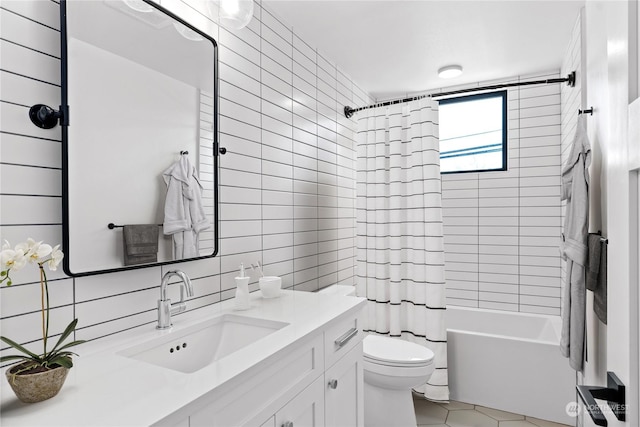 full bathroom with toilet, tile walls, vanity, shower / bathtub combination with curtain, and decorative backsplash