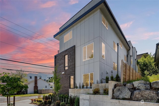 view of property exterior at dusk