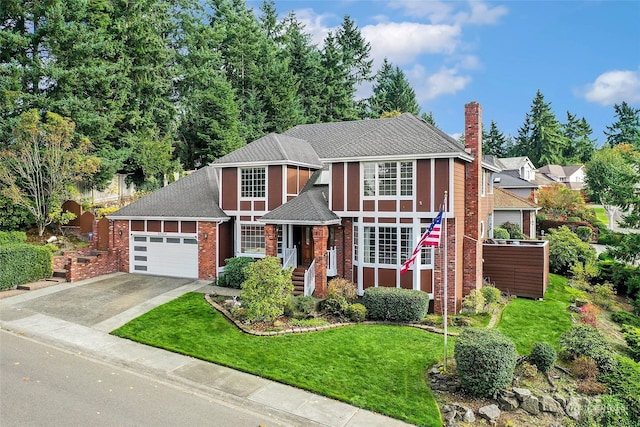 view of front of home featuring an attached garage, brick siding, concrete driveway, a chimney, and a front yard