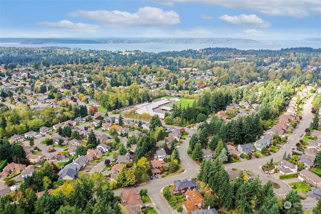 bird's eye view with a residential view and a water view