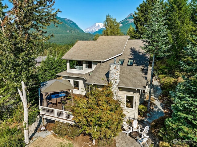132 Hellem Dr, Packwood, WA 98361 - view of front of house featuring a gazebo, a mountain view, roof with shingles, and a chimney