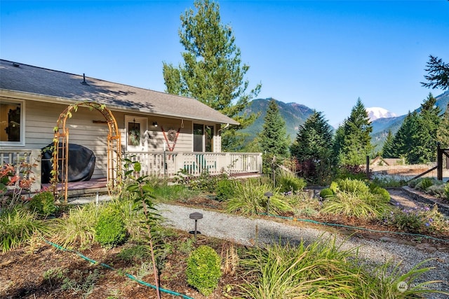 132 Hellem Dr, Packwood, WA 98361 - view of front of property featuring a deck with mountain view and roof with shingles