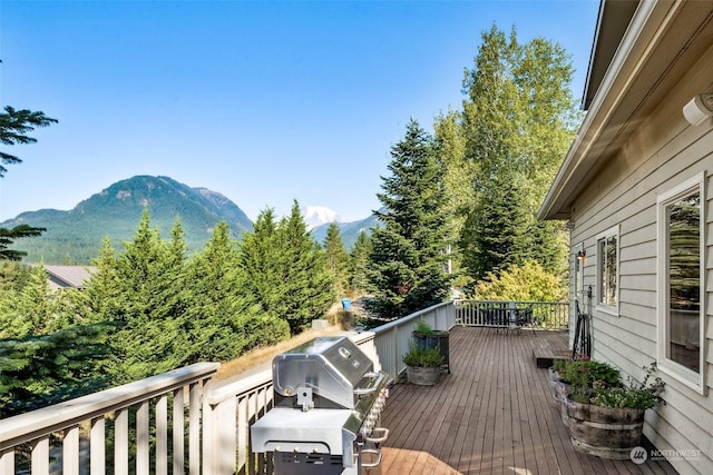 132 Hellem Dr, Packwood, WA 98361 - deck featuring a mountain view and grilling area