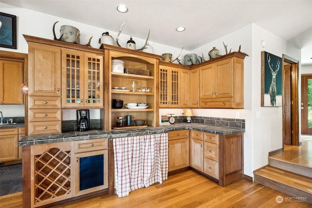 132 Hellem Dr, Packwood, WA 98361 - kitchen featuring open shelves, light wood finished floors, glass insert cabinets, recessed lighting, and tile countertops