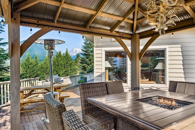 132 Hellem Dr, Packwood, WA 98361 - wooden terrace with a fire pit, outdoor dining space, a gazebo, and grilling area