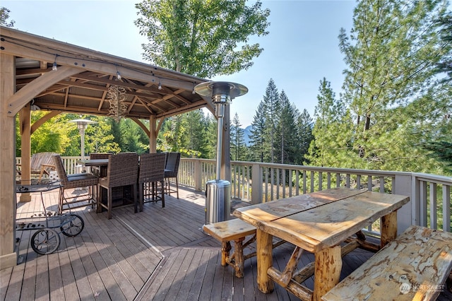 132 Hellem Dr, Packwood, WA 98361 - wooden deck featuring outdoor dining area and a gazebo
